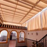 Trabajos de toldos con palillerias y cortinas laterales en el municipio de Villarrasa Huelva